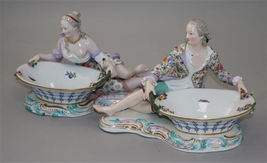 A pair of Meissen figural sweetmeat dishes, 19th century, length approx. 28cm, both with losses and slight restorations